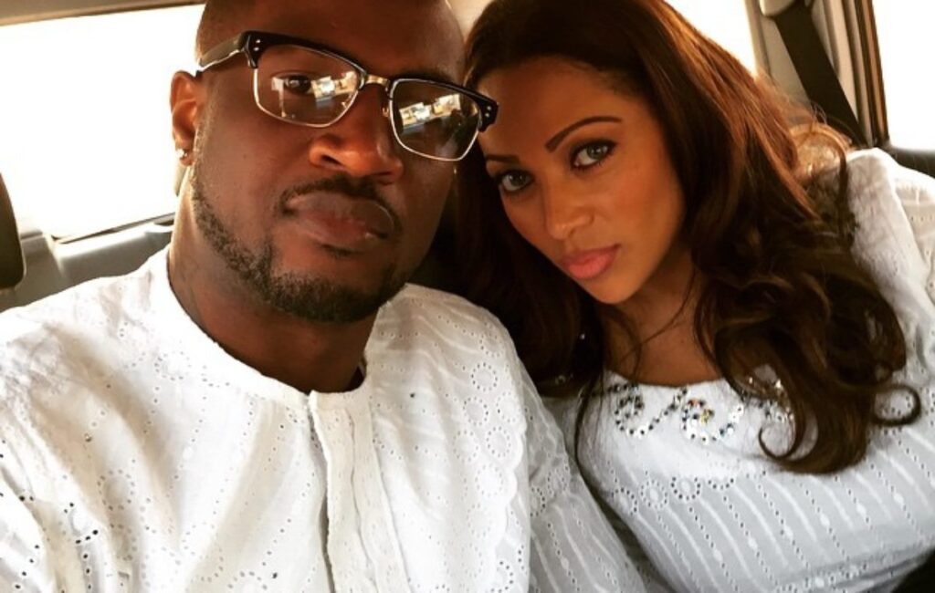 Peter Okoye's wife, Lola Omotayo puffs on a cigarette as they party together