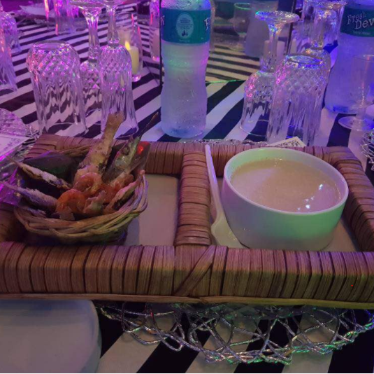 Ijebu garri and fried fish served as refreshment at a wedding reception