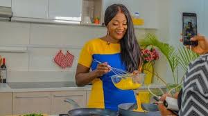 Mercy Johnson cradles her growing baby bump in new photos