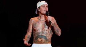 Justin Bieber with Tems, Bakar, and Hurricane Chris promoting Swag II 2025