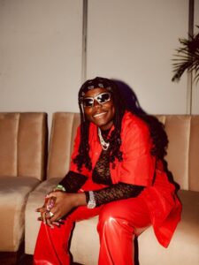 Teni in the recording studio smiling as she records her new single ready to drop in 2025.