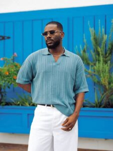 Adekunle Gold poses with the Fuji album cover art wearing traditional Yoruba attire, 2025 release.