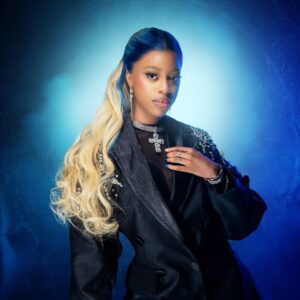 Qing Madi and Lil Wayne preview new song during Shank’s livestream, blending Afrobeats and hip-hop energy.