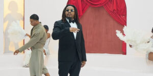Olamide Adedeji speaking at York University in Toronto after naming Wizkid the top Afrobeats artist since Fela Kuti, a moment that sparked major online debate among Afrobeats fans.