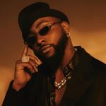 Davido discussing the verse change in his song “With You” during an interview with Omah Lay’s input.