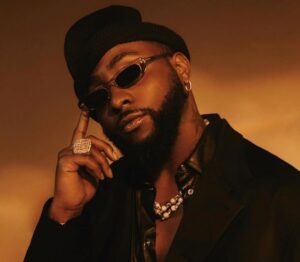 Davido discussing the verse change in his song “With You” during an interview with Omah Lay’s input.