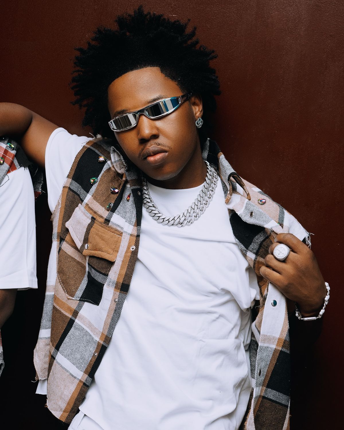 Shoday performing live on stage during The Shoday Experience with a star-studded audience.