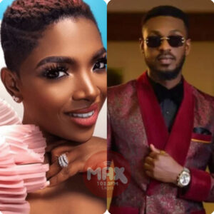 Adekunle standing on stage with Annie Idibia during a playful moment at AFRIMA 2026.