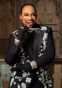 Denrele Edun discussing the Denrele Edun ageless skin glow during a radio interview on Max FM.