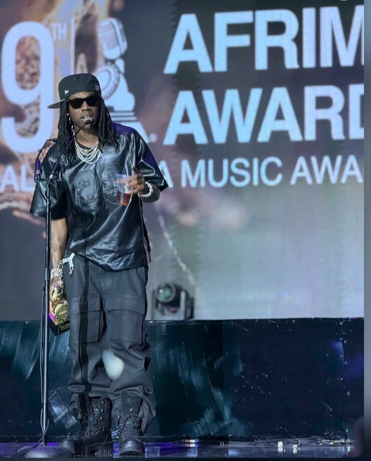 Rema celebrates his triple win at the 9th AFRIMA Awards in Lagos, Nigeria.