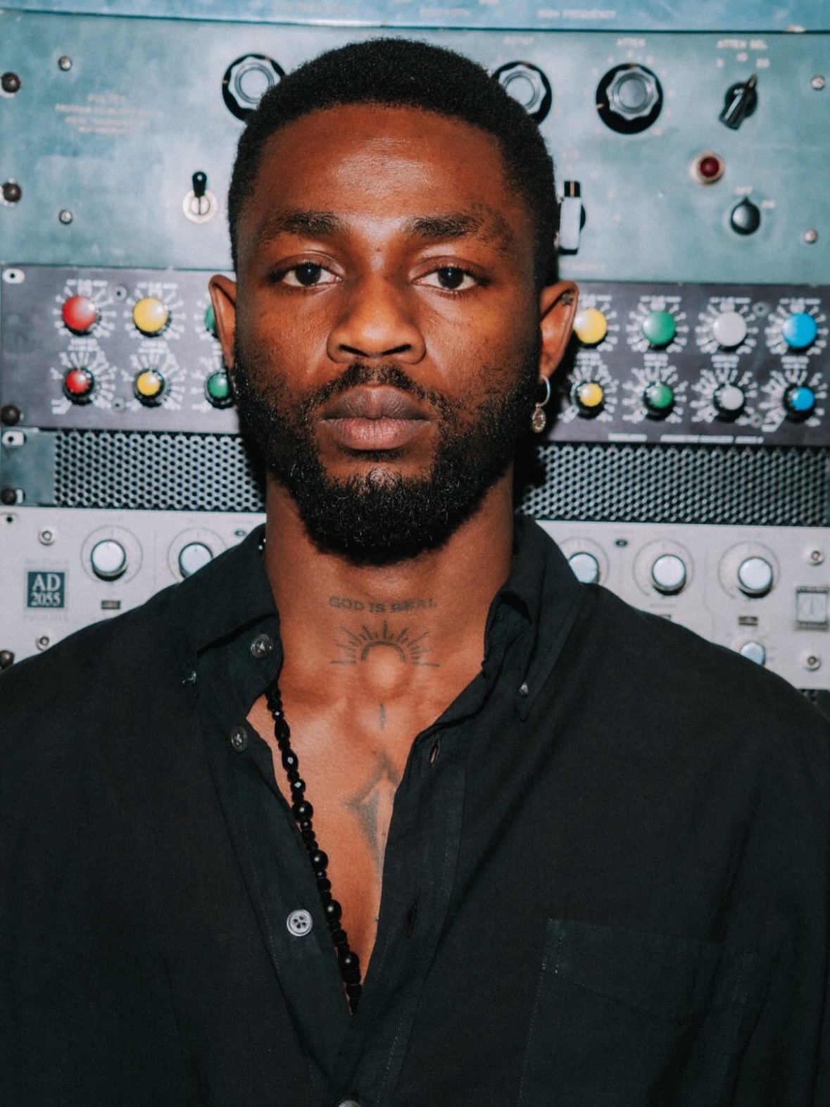 Asake performing in the studio showcasing Asake’s music style during a collaboration with Omah Lay.