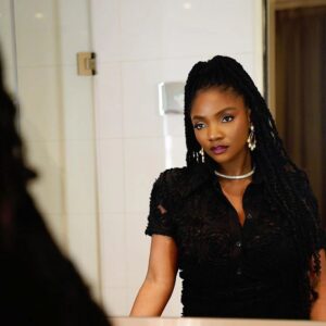 Portrait of Simi speaking about the Simi old tweet controversy and explaining the original context.