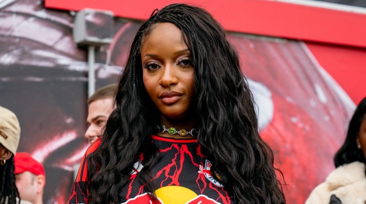 Ayra Starr discussing her favorite Afrobeats artists Tiwa Savage, Wizkid, and Rema during an interview.