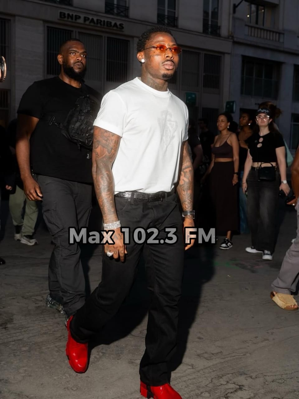 Asake performs songs from his album M$NEY during Christian Louboutin's Paris Fashion Show in 2026.