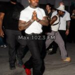 Asake performs songs from his album M$NEY during Christian Louboutin's Paris Fashion Show in 2026.