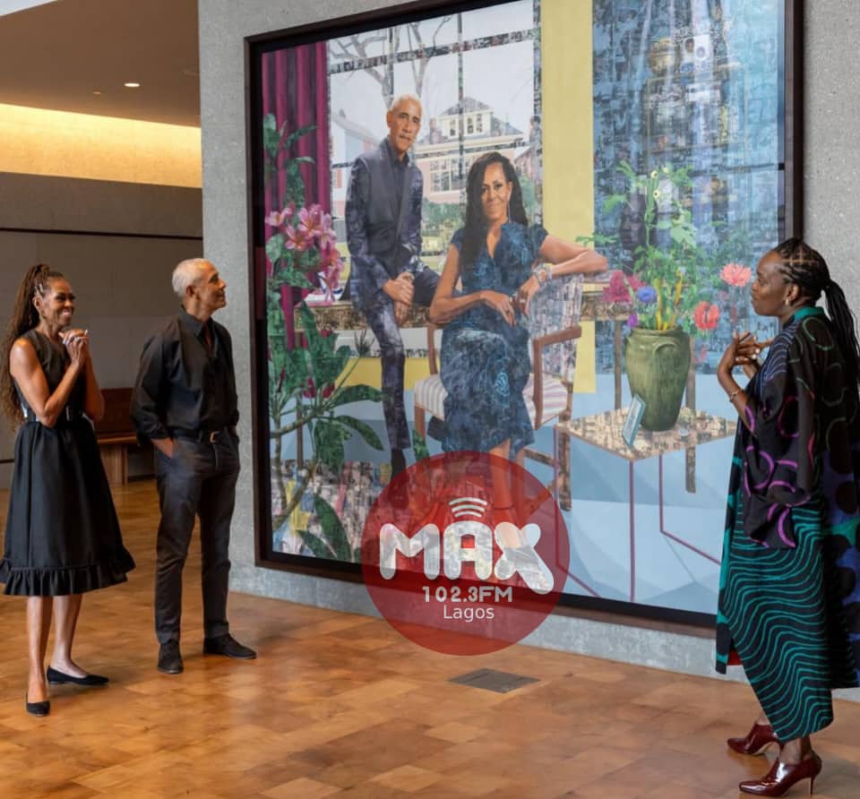 Visitors standing in front of a large portrait artwork by Nigerian artist Njideka Akunyili Crosby in a gallery space.