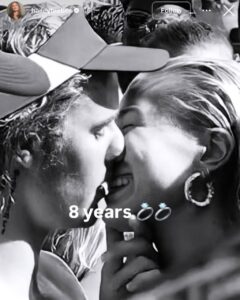 Hailey Bieber and Justin Bieber share a kiss in a black-and-white selfie posted to celebrate eight years since their engagement.