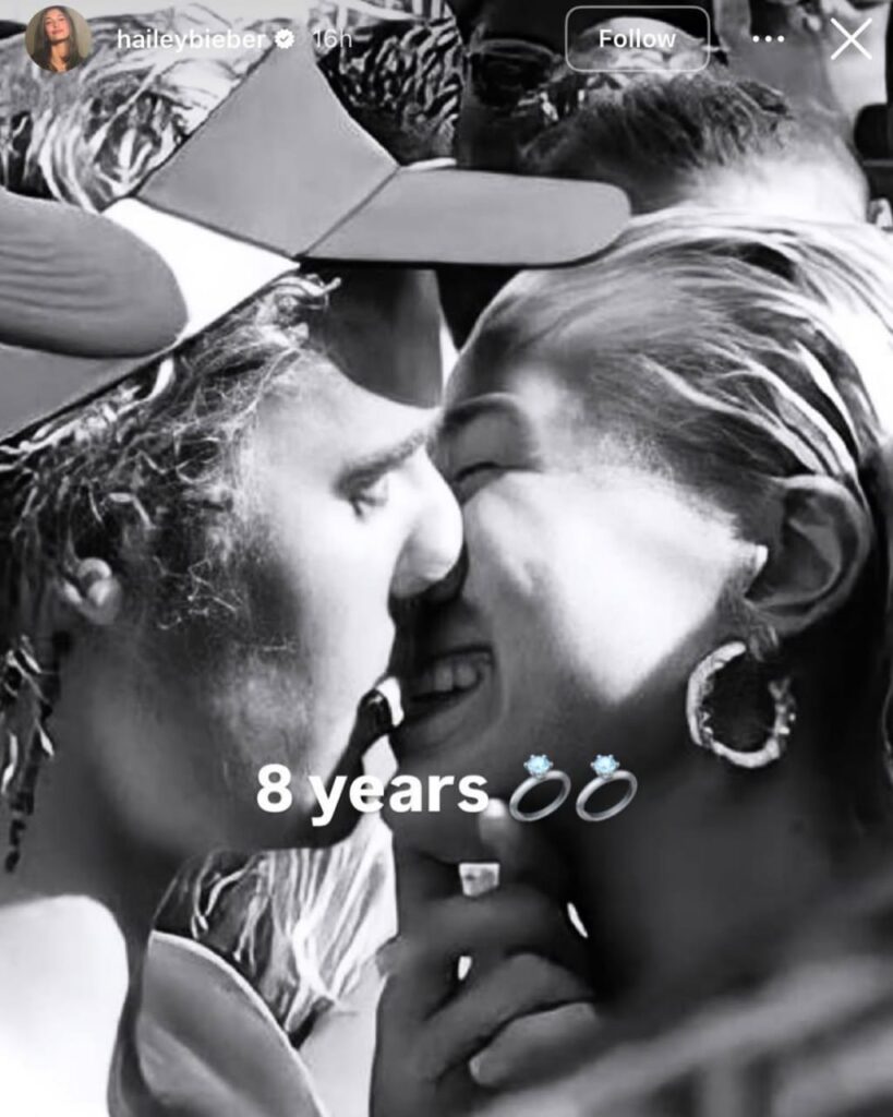 Hailey Bieber and Justin Bieber share a kiss in a black-and-white selfie posted to celebrate eight years since their engagement.