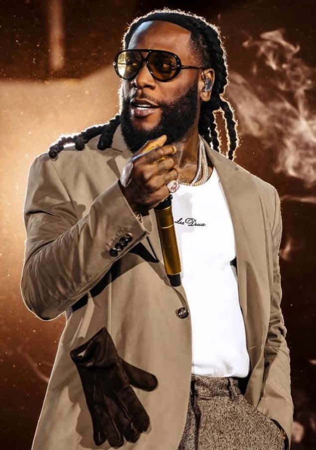 Burna Boy performing on stage during an international concert